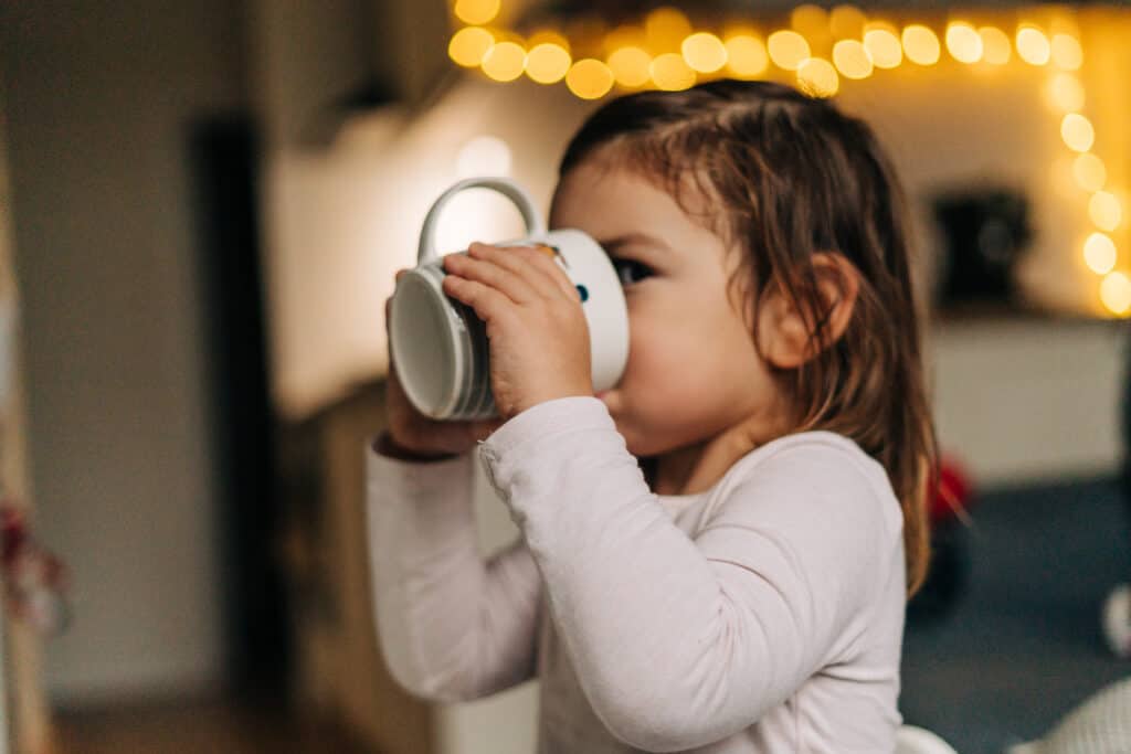 toddler drinking hot chocolate